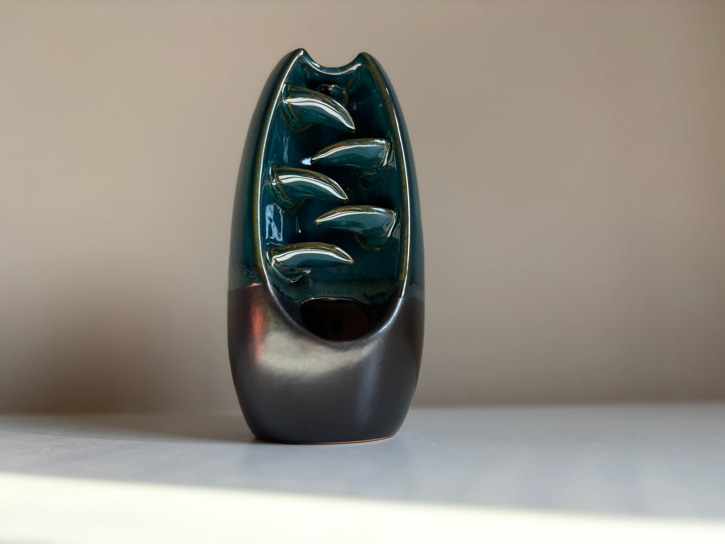 Backflow wierookbrander, waterval